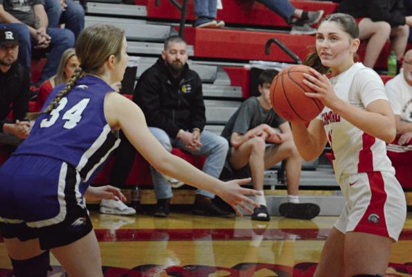 RICHMOND JUNIOR Candiace Claypole (right) looks to pass while guarded by Holden’s Annie Zillner. SHAWN RONEY | Staff
