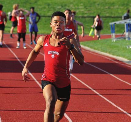 WITH A commanding lead, Richmond senior Adrian Church brings home the win for Richmond in the boys 400-meter relay April 29 at Lexington, but a school record barely eludes Church and his teammates. SHAWN RONEY | Staff