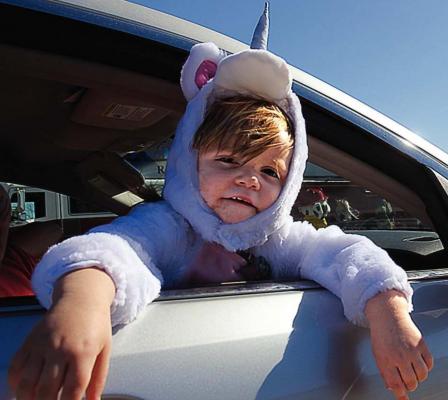 GABRIELLA STARK, 2, is a unicorn on the hunt for sugary a treat at Trick or Treat Street.