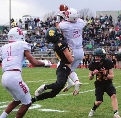 AFTER SURPRISING the Spoofhounds by faking a punt, Richmond senior quarterback Keyshaun Elliott throws a 25-yard pass from the 37 to senior