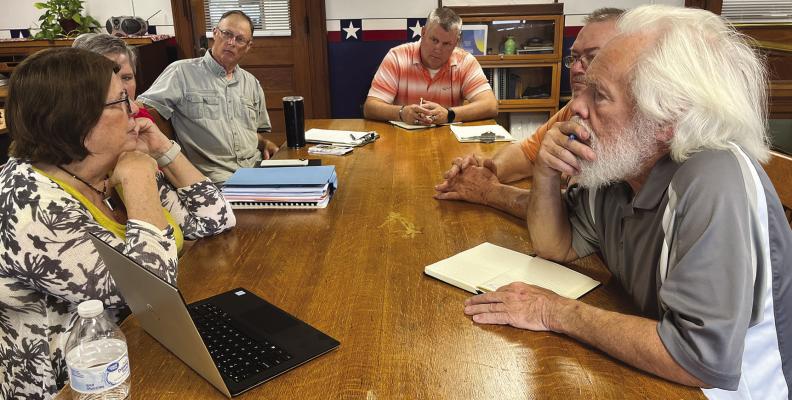 Excelsior Springs City Manager Molly McGovern (from left), Economic Development Coordinator Melinda Mahaffey and Downtown Excelsior Partnership (DEP) volunteer Keith Hudson visit Ray County Commissioners Billy Gaines, Gay Wilhite and Dave Powell. Excelsior Springs personnel asked for support as they studied the city’s flooding issues. SOPHIA BALES | Staff