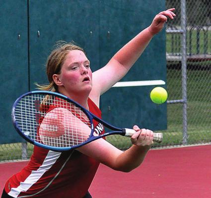 SOPHOMORE TAYLOR McGLOTHLIN hits a backhand shot during her No. 1 singles match Tuesday as she and her fellow Spartans host Carrollton in a varsity dual at Maurice Roberts Park. SHAWN RONEY | Staff
