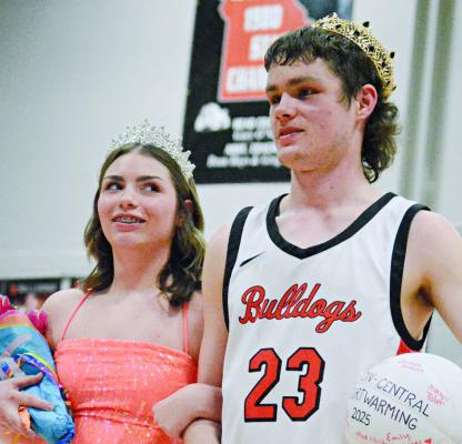 RENEE GRYMALA (left) and Kaleb Gant are crowned courtwarming queen and king, respectively, after Hardin-Central’s varsity girls and boys basketball games with Orrick. SHAWN RONEY | Staff