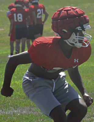 CHRIS WEBB works on his pass coverage technique during Richmond’s team camp for varsity 11man football Monday morning on the practice field on the high school campus. Webb and his fellow Spartans will have another series of camp sessions July 17-20 at the high school. SHAWN RONEY | Staff