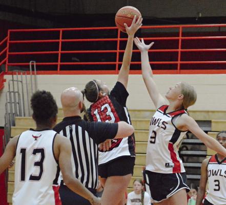 SEEMINGLY SURROUNDED by a parliament of Owls, Richmond’s Emma Hash (No. 13) leaps for the opening tipoff Monday against Marshall in summer-league play at Oak Grove. Hash and her Richmond teammates rebound from a loss to Marshall a few hours later by thumping Fort Osage, also at Oak Grove. SHAWN RONEY | Staff