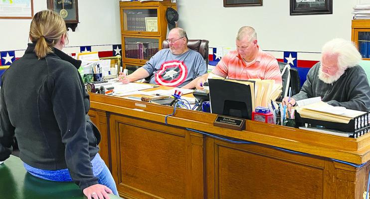 HEATHER MAULSBY GRAFF (left) discusses business with Ray County Commissioners Gary Wilhite, Billy Gaines and Dave Powell. SOPHIA BALES | Staff