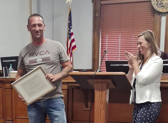 Rickie Hicks (left) graduates from the Ray County Drug Court program as Ray County Prosecutor Camille Johnston applauds his accomplishments. MIRANDA JAMISON | Staff