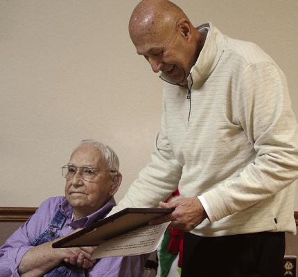 STATE REP. TERRY THOMPSON (right) presents a Missouri House resolution honoring World War II veteran Graham C. Myers Jr. for his naval service. SHARON DONAT | Staff