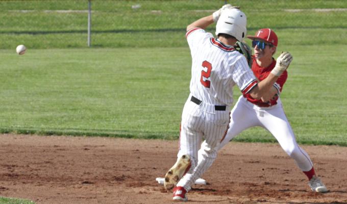 LOCHLAN STEELE (left) gets ready to slide to try to beat a throw to second base during Richmond’s 5-4 loss to Carrollton. The Spartans rebounded from the one-run May 1 defeat by edging Oak Grove 8-6 on the road, putting them at 6-11 overall entering Tuesday’s meeting with Pleasant Hill. SHAWN RONEY | Staff