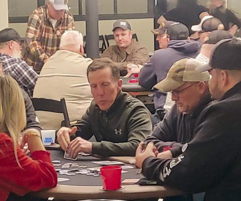 RICHMOND EDUCATION FOUNDATION President Dr. Jonathon Renfro contemplates his next move during the annual Texas Hold’em Fundraiser. SHARON DONAT | Staff