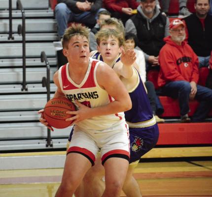 SENIOR THOMAS MURPHY drives the baseline for the Spartans Jan. 6 against visiting Pleasant Hill in varsity boys basketball action. SHAWN RONEY | Staff