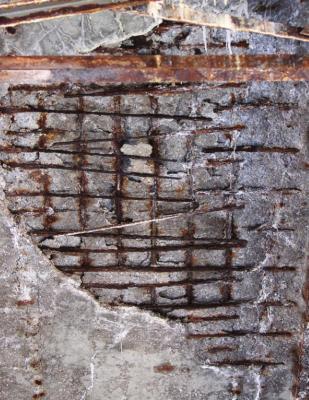 THE UNDERSIDE of the old Highway 13 overpass in Henrietta shows where concrete is missing and rebar is bared to the elements.