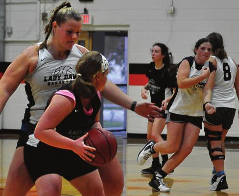 HER ARMS outstretched, Hardin-Central senior Morgan Finley works on her defensive skills Nov. 8 in the Hardin-Central gym. SHAWN RONEY| Staff