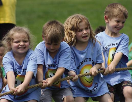 HARPER BIRDSONG (from left), Kane Edgman, Maddie Williams and Wrangler Lee pull with all their might. See more Field Day photos on Page 12. SOPHIA BALES | Staff