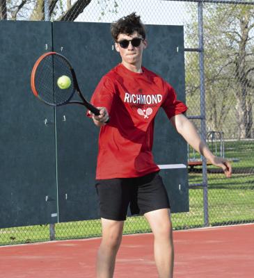 BRODY BURNINE hits a forehand shot during his No. 5 singles match with Cameron’s Ethan Turner April 13 at Maurice Roberts Park. SHAWN RONEY | Staff
