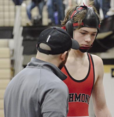 RICHMOND JUNIOR Brady Hyder (right) receives some coaching during the Class 2 District 4 Tournament. SHAWN RONEY | Staff