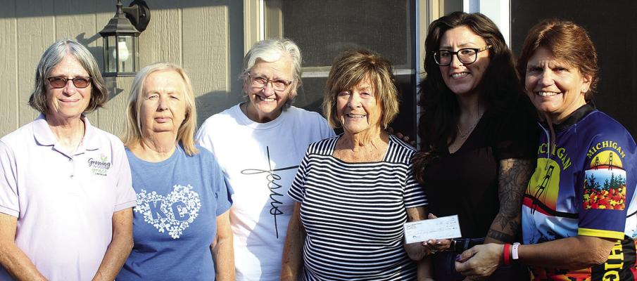 CARLA ELENZ (left) and Kathy Sowers (right) accept a donation from Faith Lutheran LWML members Tonya McBee, Donna Shane, Marian Berning and Cierra Miller. SHARON DONAT | Staff
