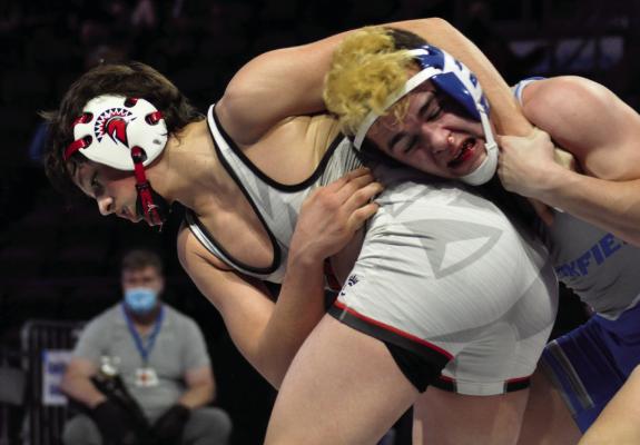 RICHMOND WRESTLING coach Cody Hogan sees Elijah Sanders, left, pictured wrestling in 2021, as a state title contender in February 2023. SHAWN RONEY | Staff