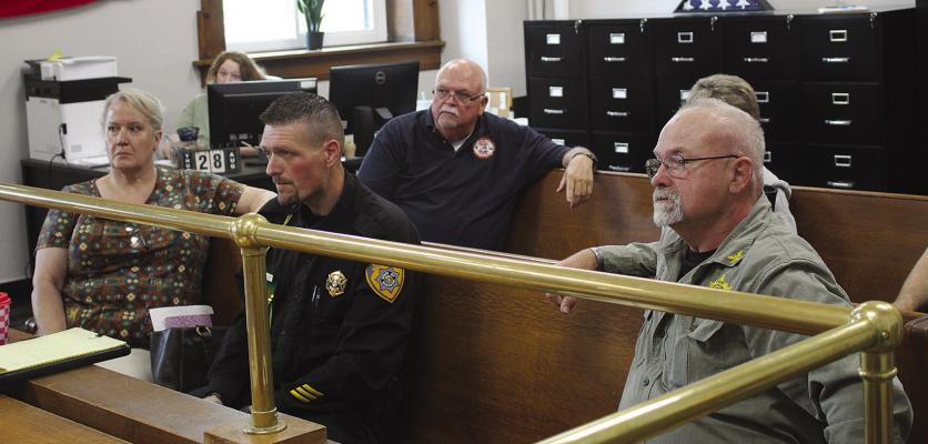 WOOD HEIGHTS MAYOR Michelle Lambert (from left), Wood Heights Police Officer Brandon Ehlen, Hardin Fire Chief Malcom Cunningham, Orrick Fire Chief Kelly Bilton and Ray County Sheriff Gary Blackwell discuss the importance of having a county emergency management director during disasters. SHARON DONAT | Staff