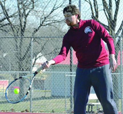 ZACHARY BALDAUF, Richmond’s new boys tennis coach, hits a forehand shot as he preps the Spartans for their spring schedule. SHAWN RONEY | Staff
