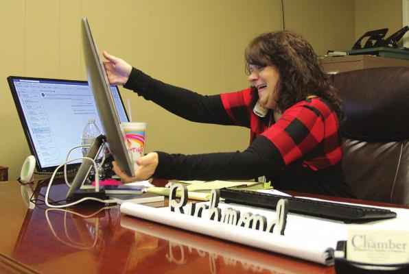 AT THE RICHMOND Chamber of Commerce Office, Carolyn Arney is at work in her new role as executive director. Arney worked previously as the assistant director. J.C. VENTIMIGLIA | Staff