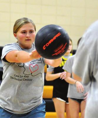 JUNIOR JANIE KILGORE practices passing in November in the Orrick High School gym. SHAWN RONEY | Staff