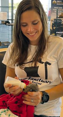 TERESA JENNINGS cares for a bottle-fed kitten at Ace’s Sanctuary &amp; Cat Rescue. Submitted