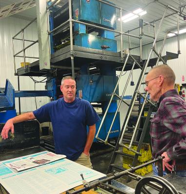RICHMOND NEWS Pressman Danny Shull talks press work with attendee Edwin Sutton at the National Newspaper Week event last Thursday. SOPHIA BALES | Staff