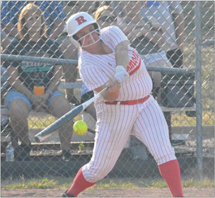 ELIZABETH WOOD swings at a pitch Monday against Lexington at Southview Park in Richmond. SHAWN RONEY | Staff