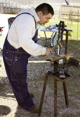 JEREMIE HOWELL OF H&amp;H Arts uses traditional blacksmithing techniques to make items at the homesteading Easter event. SOPHIA BALES | Staff