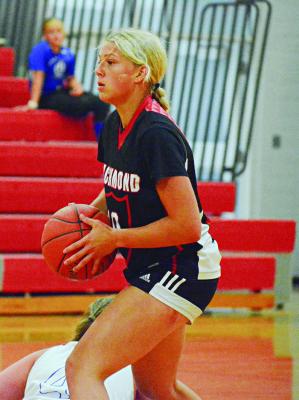 KAYLEE PUGH looks to pass Monday during Richmond’s River Valley Shootout meeting with California at Carrollton High School. SHAWN RONEY | Staff