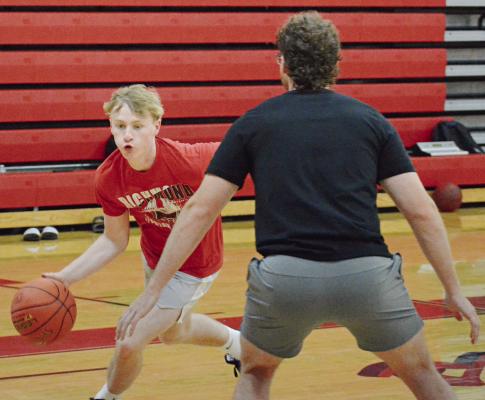 NOLAN QUICK (left) drives with the ball during a drill while at a Richmond boys basketball camp session for high schoolers. Additional coverage is on page 12. SHAWN RONEY | Staff