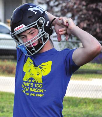 BRAYDEN SCHICK stretches Monday at Hardin-Central as he and his fellow NHC Aggies begin work to pursue their second victory this season. SHAWN RONEY | Staff