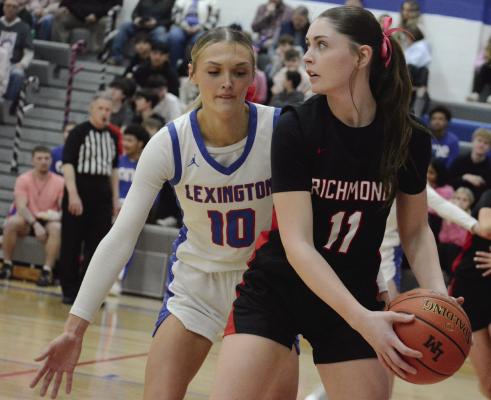 RICHMOND POST PLAYER Candiace Claypole shields the ball from Lexington’s Ardyn Hamacher. SHAWN RONEY | Staff