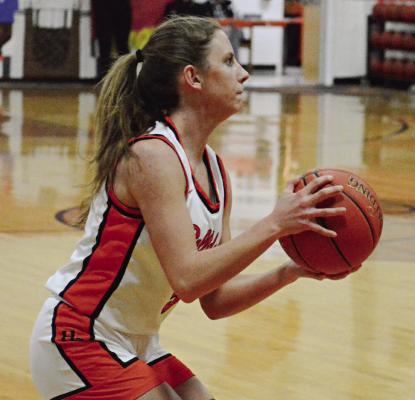 ESTER KINCAID considers her next move during the first half of Hardin-Central’s Feb. 1 home meeting with Wellington-Napoleon. SHAWN RONEY | Staff
