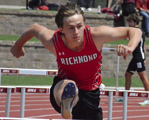 DAYNE LOFTIN bolts over a hurdle during the finals of the boys 110-meter high hurdles at the Class 3 Sectional 4 meet, held recently at Warrensburg High School. SHAWN RONEY | Staff