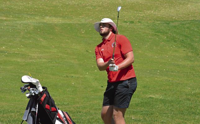 SOON-TO-BE Richmond graduate Jack Gogue watches his chip shot near the end of his round Monday at the Class 3 District 4 Tournament at Shirkey Golf Course. SHAWN RONEY | Staff