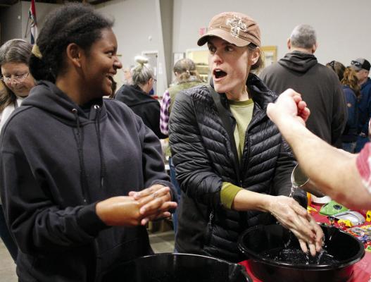 DAKOTA AND REVA BELL are shocked by the scrub they are trying, which is called Mountain Man Skrub. They are attending the First Annual Homesteading in Ray County Regional Swap Meet and Convention. The two enjoy walking around and scanning booths. SOPHIA BALES | Staff