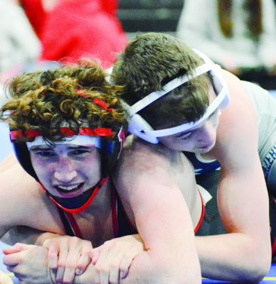 RICHMOND JUNIOR Declan Cockrum fights to get out from the bottom position during a Class 1 District 3 match Feb. 18 at Lafayette County of Higginsville. SHAWN RONEY | Staff
