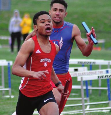 SENIOR ADRIAN CHURCH fights to keep Richmond’s lead Tuesday in the boys 400-meter relay at Lexington. SHAWN RONEY | Staff
