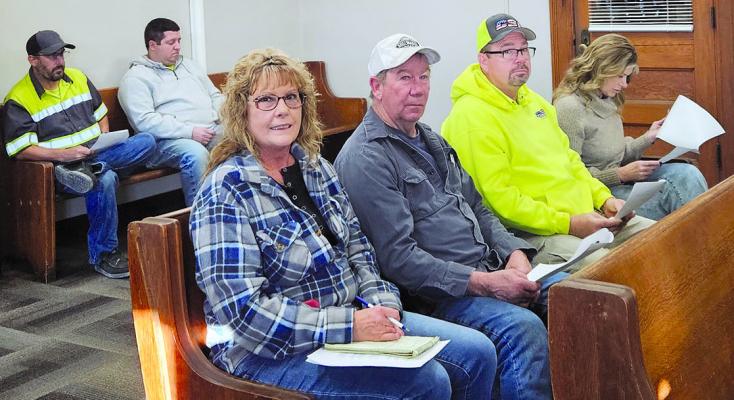 LOCAL TOW OPERATORS and community members review a draft resolution outlining potential changes to towing policies in Ray County. MIRANDA JAMISON | Staff