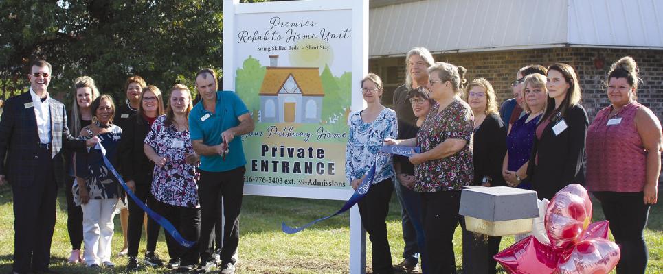 RICHMOND AREA CHAMBER of Commerce members and Rehab to Home employees cut the ribbon in celebration of the new unit at Shirkey Nursing and Rehab. SHARON DONAT | Staff