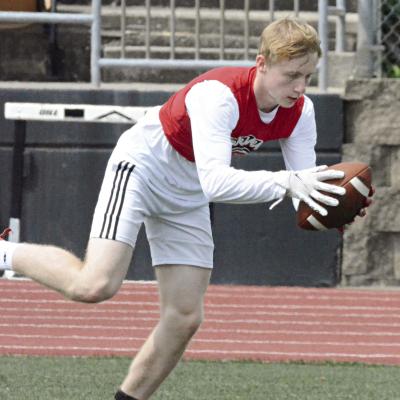 RICHMOND WIDEOUT Nolan Quick keeps his concentration and lunges to haul in a tipped pass as the Spartans run a play against Liberty’s defense during 7-on-7 scrimmaging Tuesday at Tiger Stadium in Excelsior Springs. SHAWN RONEY | Staff