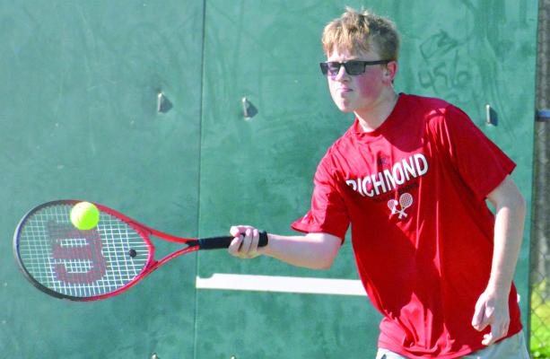 SOPHOMORE PAXTON QUICK attempts a forehand shot in singles play during Richmond’s week-opening dual with Carrollton. After edging Carrollton 5-4 April 15 on the road, the Spartans drop the rematch 5-4, also their final home competition of the regular season. Richmond is slated to finish its regular-season dual schedule Friday at Odessa. SHAWN RONEY | Staff