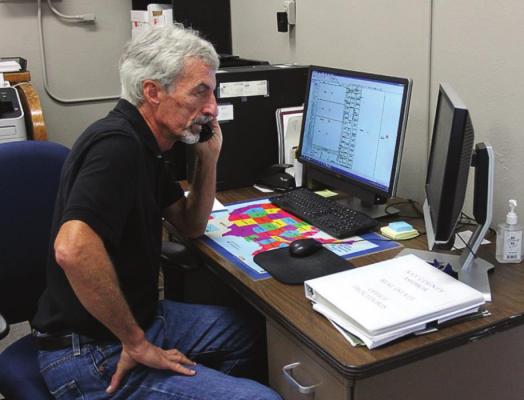ASSESSOR Kent Wollard works even on his last day.
