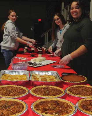 JUST DESSERTS are prepared for Thanksgiving dinner by, from left, Brooklynn Lowery, 14; Maryann Gingerich, 11; and Nina Barron, 24. J.C. VENTIMIGLIA | Staff