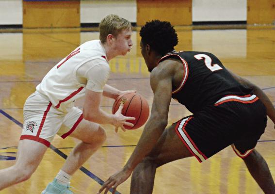 RICHMOND LOOKS to start the new year by getting back to .500 in varsity boys basketball. SHAWN RONEY | Staff