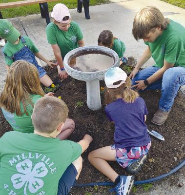 MILLEVILLE 4-H CLUB does a variety of projects, including planting flowers annually at Shirkey Nursing and Rehabilitation Center in Richmond. Submitted