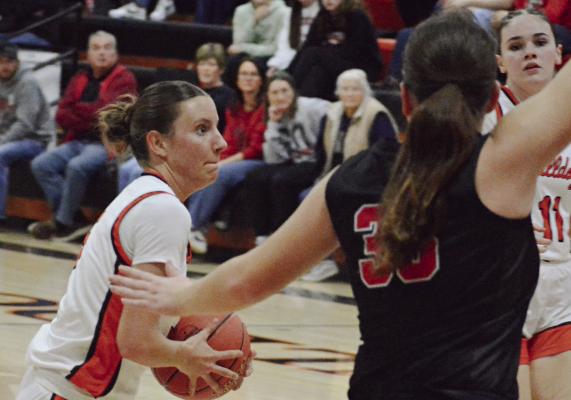 SENIOR ESTER KINCAID (left) drives against the Braymer defense. Kincaid helped the Hardin-Central varsity girls post a 56-40 win. The Jan. 22 home victory put the girls at 10-5 overall entering this week. SHAWN RONEY | Staff