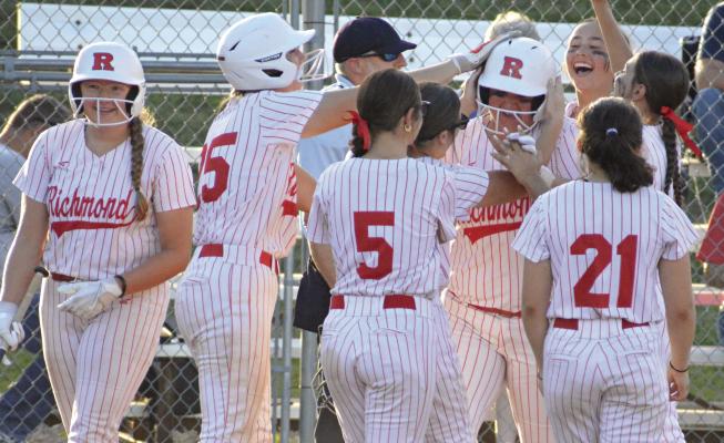 ELIZABETH WOOD, shown being congratulated at home plate her senior season, is among the varsity softballers Richmond lost to graduation. The Spartans return three starters from 2025. SHAWN RONEY | Staff